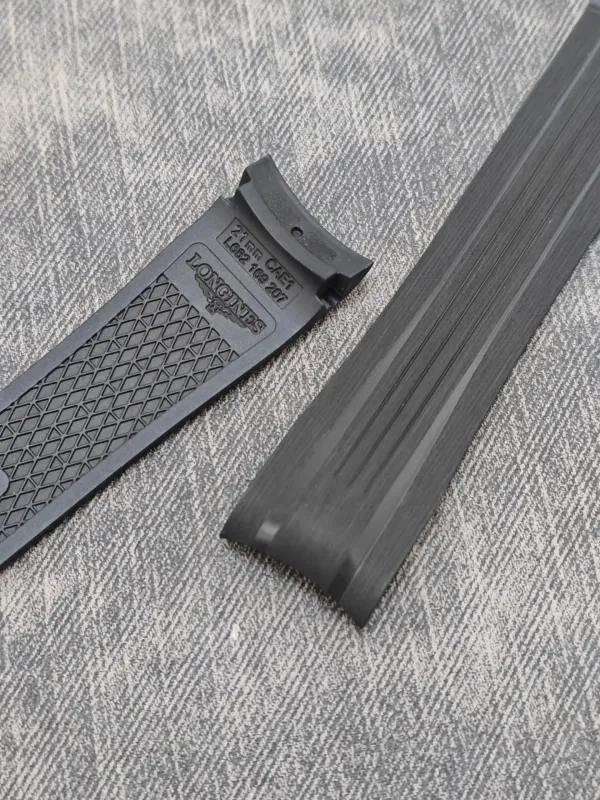 Close-up of the curved end of an FKM rubber strap for Longines Conquest GMT.