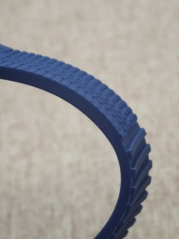 Blue FKM rubber strap for Porsche Design P6360, showing the ribbed underside.
