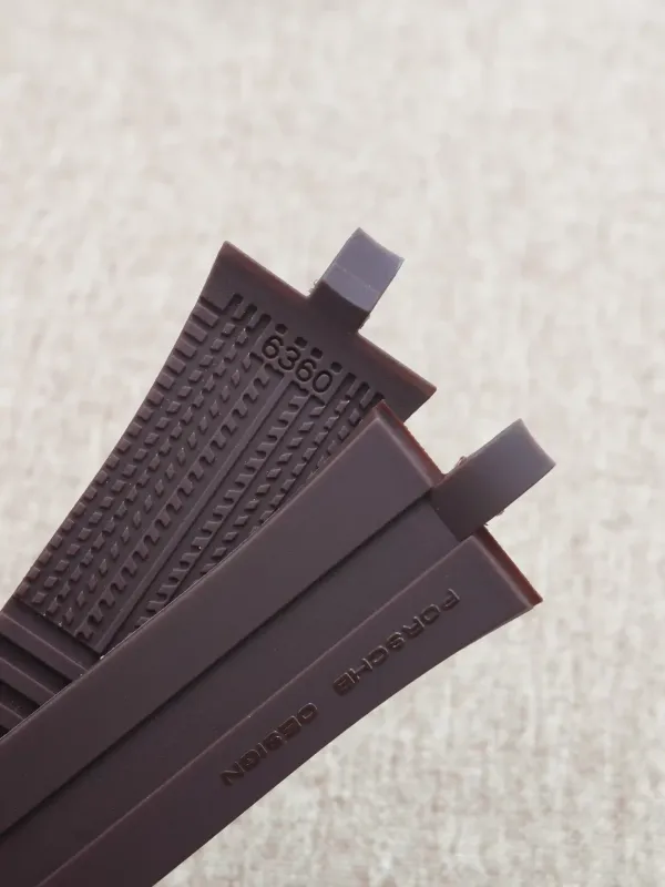Close-up of the segmented underside of a brown rubber strap for Porsche Design P6360.