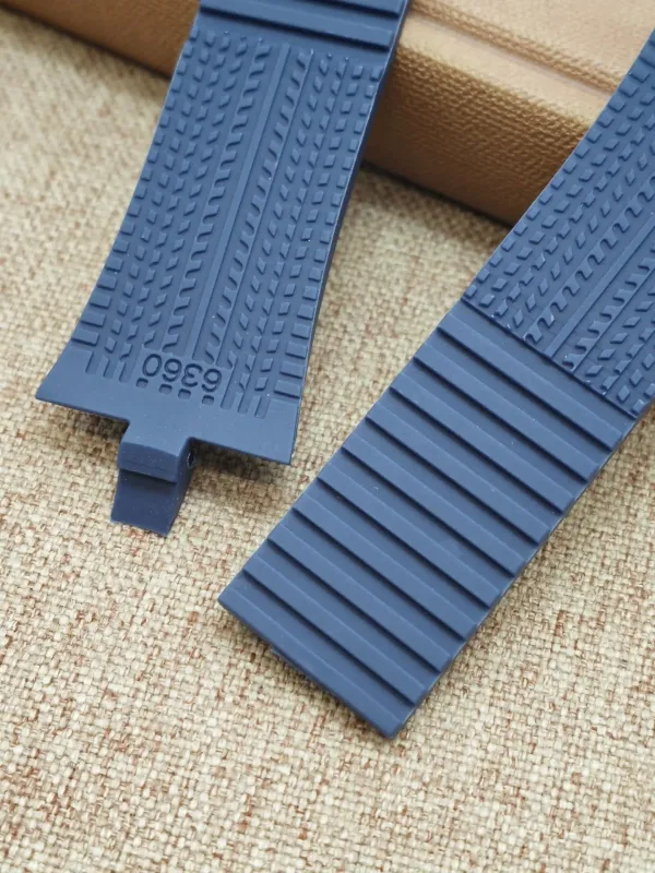 Two blue rubber strap sections for Porsche Design P6360, showing the ribbed texture.