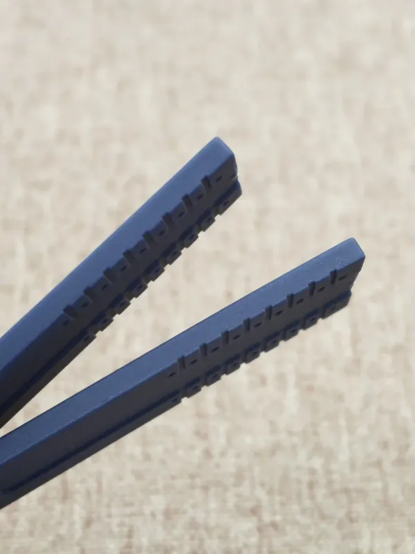 Two blue rubber straps for Porsche Design P6780 showing the ribbed inner surface.